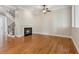 Spacious living room with hardwood floors and a cozy fireplace, creating a warm and inviting atmosphere for relaxation at 5882 Riverstone Cir # 15, Atlanta, GA 30339