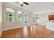 Bright living room with hardwood floors, arched windows, and modern light fixtures at 5882 Riverstone Cir # 15, Atlanta, GA 30339