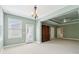 Carpeted main bedroom boasting a tray ceiling, walk-out to the deck, and en suite bathroom at 5882 Riverstone Cir # 15, Atlanta, GA 30339