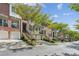 Charming street view of well-maintained townhouses with lush green trees, enhancing the neighborhood's appeal at 5882 Riverstone Cir # 15, Atlanta, GA 30339