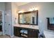 Bathroom featuring a double vanity sink and great lighting at 9013 Aldbury Dr, Locust Grove, GA 30248