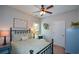 Cozy bedroom featuring a ceiling fan, neutral walls, and comfortable furnishings at 9013 Aldbury Dr, Locust Grove, GA 30248