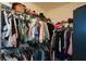 Walk-in closet featuring abundant storage with racks for clothing and accessories at 9013 Aldbury Dr, Locust Grove, GA 30248