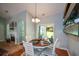 Charming dining area with a round table and seamless access to the fireplace and outdoor patio at 9013 Aldbury Dr, Locust Grove, GA 30248