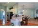 Open kitchen with stainless steel appliances, a breakfast bar, and views into the living room at 9013 Aldbury Dr, Locust Grove, GA 30248