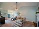 Inviting living room featuring vaulted ceilings and views of the home's entryway and fireplace at 9013 Aldbury Dr, Locust Grove, GA 30248