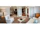 Spacious living room boasts open floor plan, and multiple entry points creating a bright and airy atmosphere at 9013 Aldbury Dr, Locust Grove, GA 30248