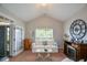 Inviting living room with a fireplace and vaulted ceilings providing a comfortable and stylish retreat at 9013 Aldbury Dr, Locust Grove, GA 30248