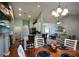 Open concept living space with a kitchen, dining area, and living room, all with light blue walls at 9013 Aldbury Dr, Locust Grove, GA 30248