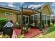 Outdoor patio with awning, wicker furniture, and sliding glass doors to the home at 9013 Aldbury Dr, Locust Grove, GA 30248