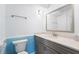 Bathroom featuring a vanity, bright blue accent tile, and a large mirror at 91 Rumson Rd, Atlanta, GA 30305