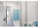 Bright bathroom showcasing blue accent tile and vintage-style fixtures at 91 Rumson Rd, Atlanta, GA 30305