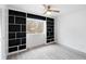 Bedroom featuring custom built-ins, hardwood floors, and a window offering natural light at 91 Rumson Rd, Atlanta, GA 30305