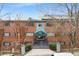Attractive brick apartment building with green shutters, tasteful landscaping, and inviting main entrance at 91 Rumson Rd, Atlanta, GA 30305