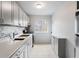 Modern kitchen featuring stone countertops, stainless steel appliances, backsplash and ample cabinet space at 91 Rumson Rd, Atlanta, GA 30305