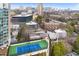 Aerial view of a tennis court on top of a building with the cityscape in the background at 91 Rumson Rd, Atlanta, GA 30305