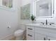 Contemporary half bathroom featuring a square mirror, modern fixtures and a sleek vanity at 138 Beutell St, Norcross, GA 30071