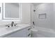 Modern bathroom with marble tile and dual black hardware at 138 Beutell St, Norcross, GA 30071