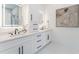The bathroom features double sinks with modern fixtures, sleek cabinetry, and a well-lit vanity at 138 Beutell St, Norcross, GA 30071