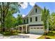 Charming two-story home features a well-kept lawn, with fresh landscaping, and a two car garage at 138 Beutell St, Norcross, GA 30071