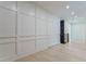 Bright hallway with wainscoting, recessed lighting, and hardwood flooring at 138 Beutell St, Norcross, GA 30071
