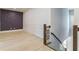 Hallway area with a dark accent wall, modern railings and hardwood floors at 138 Beutell St, Norcross, GA 30071