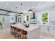Bright, open kitchen with a large island, stylish pendant lighting, and stainless steel appliances at 138 Beutell St, Norcross, GA 30071