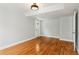The room features hardwood floors, recessed lighting, and a back door to the outside at 300 Rocky Cove Trl, Lawrenceville, GA 30044