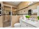 Bathroom featuring a tiled shower with a glass door and updated vanity at 300 Rocky Cove Trl, Lawrenceville, GA 30044