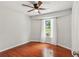 Bedroom featuring hardwood floors, a window, and natural light at 300 Rocky Cove Trl, Lawrenceville, GA 30044