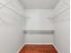 Walk-in closet featuring hardwood floors and wire shelving at 300 Rocky Cove Trl, Lawrenceville, GA 30044