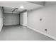 Clean, freshly painted two-car garage with a garage door and side door; well-lit and ready for parking at 300 Rocky Cove Trl, Lawrenceville, GA 30044