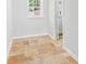 Room with tile flooring, a white wall and baseboards, and a window on the upper left at 300 Rocky Cove Trl, Lawrenceville, GA 30044