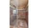 Luxurious tiled shower featuring glass enclosure, and a multi-setting shower head, ideal for a spa-like experience at 300 Rocky Cove Trl, Lawrenceville, GA 30044