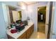 Bathroom view showcasing large mirror, double sink vanity, and open doorway at 501 Textbook Ct, Lawrenceville, GA 30044