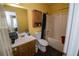 Bathroom with a tub-shower combination, white toilet, and a light wood vanity with a white sink at 501 Textbook Ct, Lawrenceville, GA 30044