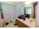 Bathroom has a large mirror, a vanity with a sink, and a toilet at 501 Textbook Ct, Lawrenceville, GA 30044