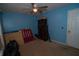 A bedroom featuring a ceiling fan and a dresser at 501 Textbook Ct, Lawrenceville, GA 30044