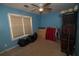A bedroom featuring a window and a ceiling fan at 501 Textbook Ct, Lawrenceville, GA 30044
