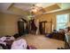 Bedroom with a ceiling fan, closet, and a window at 501 Textbook Ct, Lawrenceville, GA 30044
