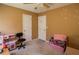 This bedroom includes two doors, a chair, and some furniture at 501 Textbook Ct, Lawrenceville, GA 30044