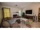 Comfortable living room with tile flooring, fireplace, and vaulted ceiling, creating an inviting space at 501 Textbook Ct, Lawrenceville, GA 30044