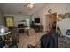 Comfortable living room featuring a fireplace, vaulted ceiling, and tile flooring at 501 Textbook Ct, Lawrenceville, GA 30044