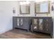 Bathroom featuring double sink vanity with framed mirrors and plenty of storage space at 1931 Amber Dawn Way, Lawrenceville, GA 30043