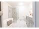 Bright bathroom with soaking tub, glass shower, vanity with marble countertop at 1931 Amber Dawn Way, Lawrenceville, GA 30043