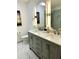 Elegant bathroom boasting a dual sink vanity, modern fixtures, and marble countertops at 1931 Amber Dawn Way, Lawrenceville, GA 30043