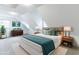 Bright bedroom under the eaves with hardwood furniture, modern lamps and plush bedding at 1931 Amber Dawn Way, Lawrenceville, GA 30043