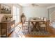 Inviting dining room featuring a large wooden table with seating for eight at 1931 Amber Dawn Way, Lawrenceville, GA 30043
