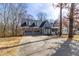 Charming blue two-story home with a stone garage and a well-maintained front yard at 1931 Amber Dawn Way, Lawrenceville, GA 30043