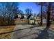 Charming two-story home with blue siding, stone accents, dormer windows and attached two-car garage at 1931 Amber Dawn Way, Lawrenceville, GA 30043